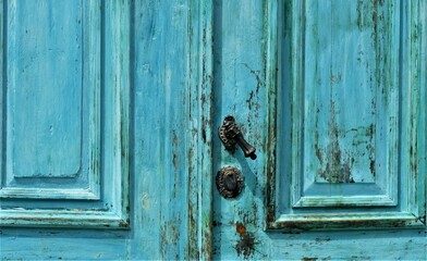 Old blue rustic door with metal handle