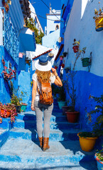 Fototapeta premium Woman tourist walking in Chefchaouen- blue city in Morocco
