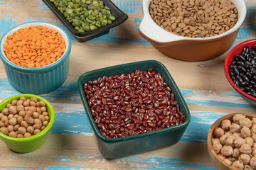 assorted bowls with raw grain and seeds top view