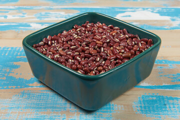 bowl with black-eyed beans on blue rustic wooden table
