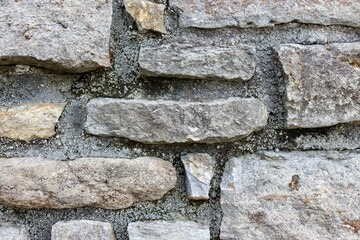 A close view of the old stone wall surface.