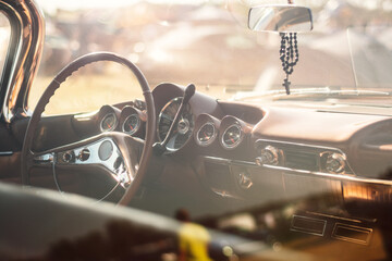 Vintage car interior with steering wheel and dashboard, vintage car background