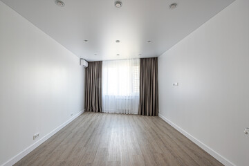 empty room without furniture with white walls and ceiling, curtains