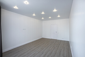 Empty room without furniture with white walls and ceiling
