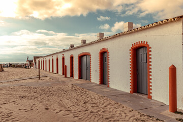 The house front of the former fishermen's huts on the beach of Barril in Santa Luzia southern...