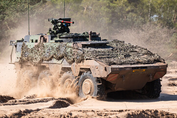 A Boxer multirole armored fighting vehicle designed by an international consortium to accomplish a...