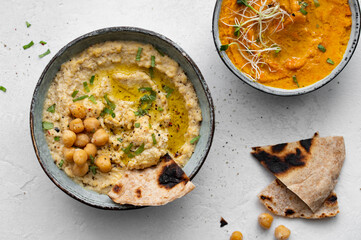 Traditional hummus and carrot hummus. Spread. Assorted meze and dips with crispy pita. Middle eastern snacks