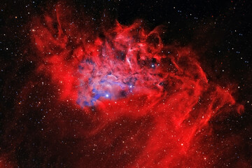 A red galaxy in deep space. Elements of this image furnished NASA.