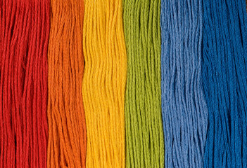 Rainbow spectrum color embroidery threads background