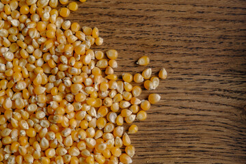 close up of dried corn on a walnut wood table