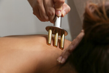 Back massage with points massager stick. Pain relief lymphatic acid drainage massage with fork for...