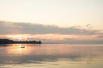 Beautiful sunrise view from Imperia statue at harbor entrance on lake Constance in early morning hours. Steamer harbor, Constance, Baden-Württemberg, Germany, Europe.