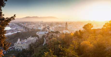 view over Malaga at sunset travel banner - obrazy, fototapety, plakaty