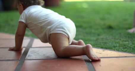 Child toddler crawling at home home outside, infant learning to move