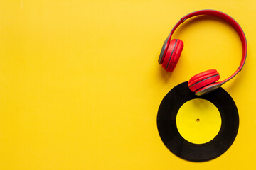 Listen to the music concept with vinyl records and headphones, top view