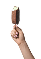 Woman holding tasty bitten chocolate covered ice cream on white background