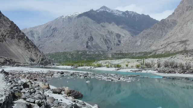 Drone flying Shyok river and towards mountains of Karakoram range from the road leading to Khaplu valley from Skardu.
