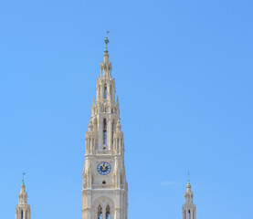 The clock tower of the town hall in Vienna against the blue sky