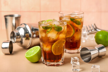 Glasses of cold Cuba Libre cocktail on table