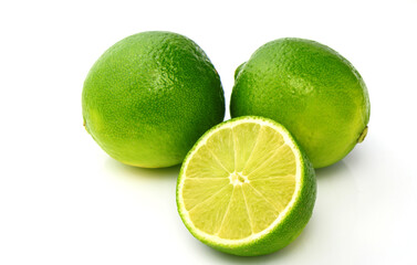 whole lime and sliced ​​lime on white background with shadows 2