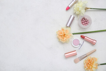 Fototapeta na wymiar Beautiful daffodils with different cosmetics on white background