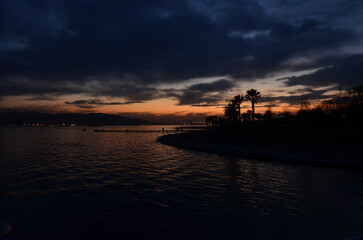 silhouette of a person on a pier