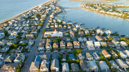 Aerial view of Wrightsville Beach, NC homes during a sunrise.