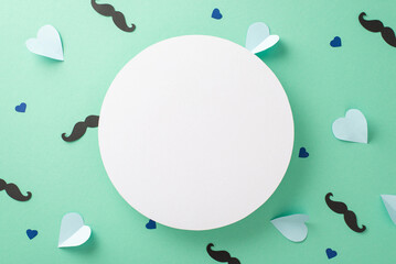 Fashion-forward Father's Day concept. Flat lay top view of white round frame, mustache, hearts on a teal background with an empty circle for text