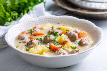 Seasoned soup with meatballs with vegetables. English name; sulu kofte, eksili kofte, terbiyeli...