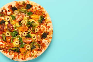 Vegetable pizza on blue background