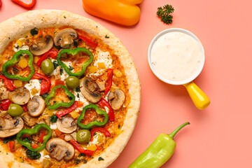 Vegetable pizza with ingredients and sauce on pink background