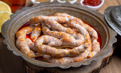 Traditional delicious Turkish cuisine, Middle Eastern dishes, offal dishes, stuffed sheep intestines (Turkish name; Mumbar dolmasi)