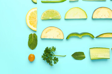 Composition with fresh fruits and vegetables on turquoise background
