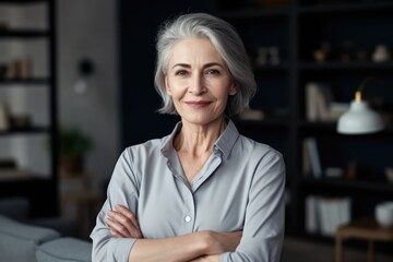 Fototapeta na wymiar Smiling confident stylish mature middle aged woman standing at home office. Mature businesswoman, gray-haired lady executive business leader manager looking at camera arms crossed, generative AI