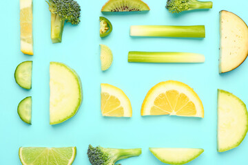 Composition with fresh fruits and vegetables on turquoise background