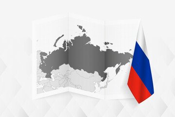 A grayscale map of Russia with a hanging Russian flag on one side. Vector map for many types of news.
