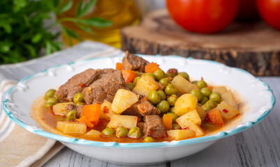 Turkish Food Green Pea Stew with Meatballs - Kofte or Kofta Bezelye. (Turkish name; kofteli bezelye)