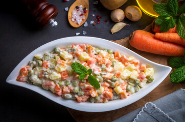 Russian salad Olivier with mayonnaise and egg served (Turkish name; Rus salatasi)