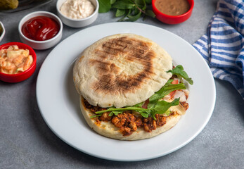 Delicious looking cold sandwich served with coleslaw sauce.