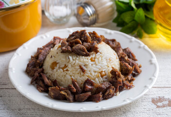 Traditional Turkish food; Roasted meat on rice (Turkish name; pilav üstü kavurma, kurban kavurma, nohutlu etli pilav) Rice pilaf with meat and chickpeas.