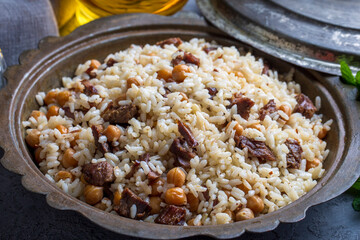 Traditional Turkish food; Roasted meat on rice (Turkish name; pilav üstü kavurma, kurban kavurma, nohutlu etli pilav) Rice pilaf with meat and chickpeas.