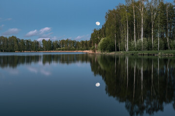 Fototapeta na wymiar Beautiful landscape view of the lake in the forest on spring evening