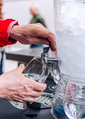 Pouring water into a glass