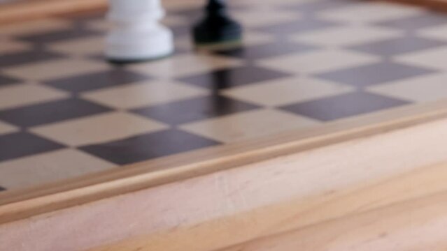 gold, bronze crown on black pawn, duel queen figures, horse on chessboard blackboard, concept supreme power, victory, symbol superiority, supreme dignity, level in hierarchy, leadership in business