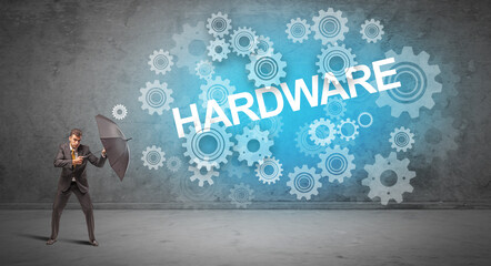 Obraz premium Businessman defending with umbrella concept