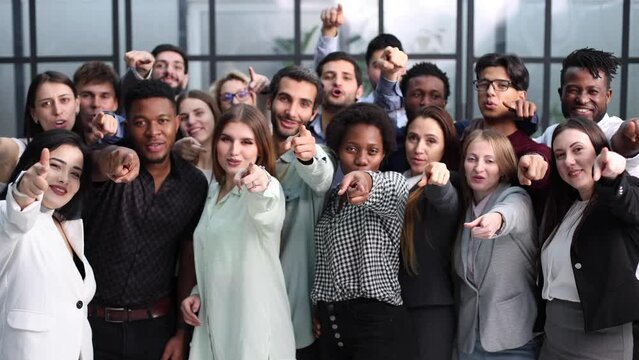 Large group of young people pointing at you.