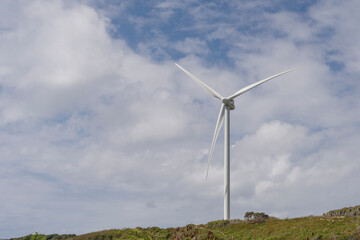 Fototapeta premium Wind farm with tall wind turbines to generate electricity.