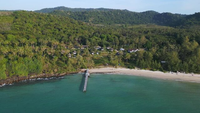 beach and wooden pier on privat jungle island Magic aerial top view flight drone Generative AI