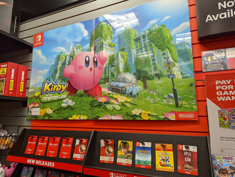 Vibrant pink Kirby and the Fogotten Land poster displayed