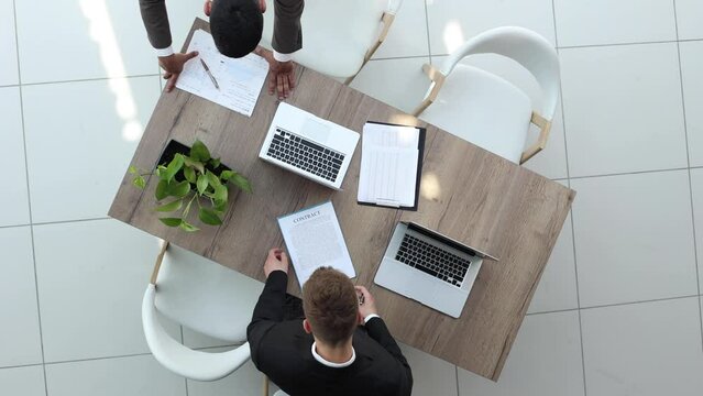 Proofreading two business colleagues in the office